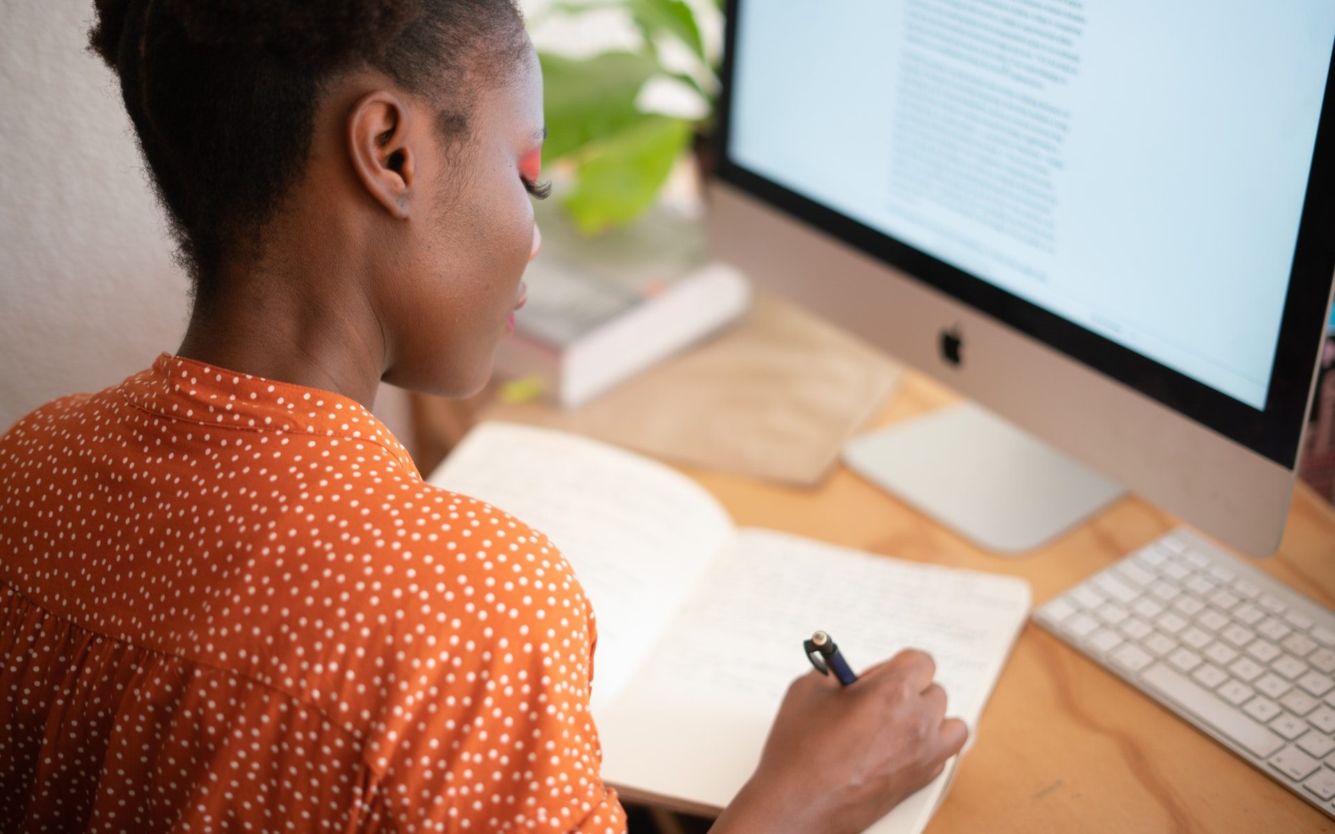woman-writing-on-her-notebook-Photo by Retha Ferguson from Pexels