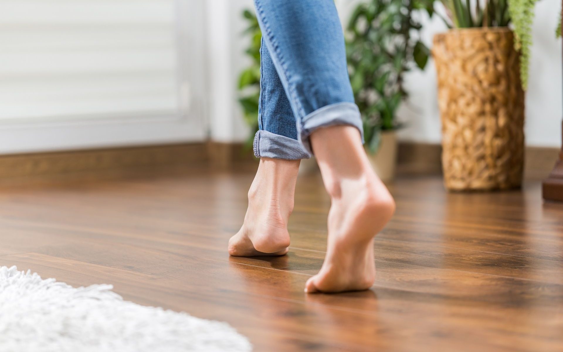 Woman walking on a wooden floor
