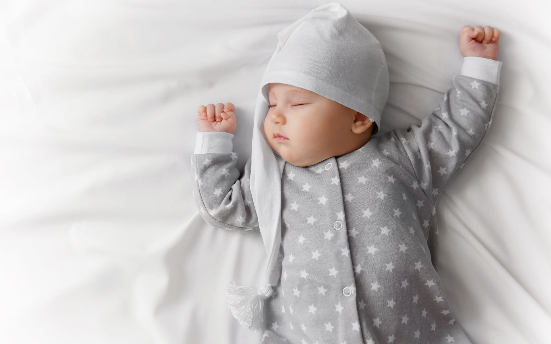 Baby sleeping on a mattress